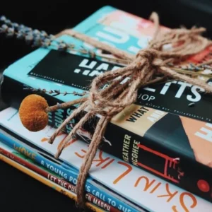 Stack of books tied together with twine.