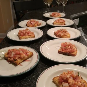 pieces of bread with vegetable medleys on plates